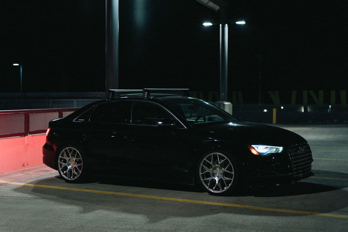 A car in an underground car park at night