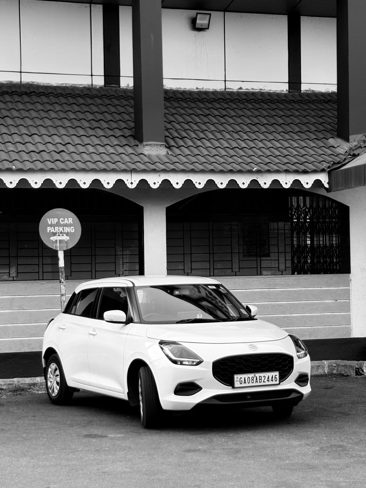 A car parked close to a residential gate
